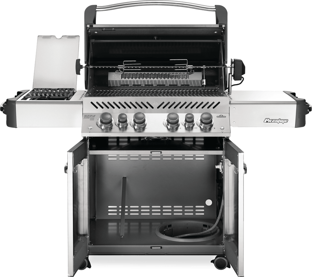 Internal view of the spacious prestige 500 series grill. Featuring collapsible sides, the sizzle zone infrared side burners, rear infrared rotisserie burner, the safetyglow control knobs, and more. Insulated lids keep you grilling at home or at the cottage all year round. Quality grills available in stainless steel, charcoal grey, or black!