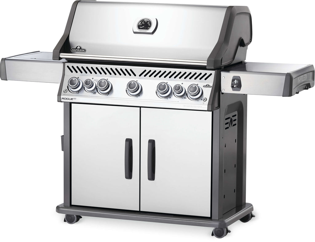 Front angle view of the largest of the Napoleon Rogue SE RSIB series, the 625 RSIB Gas Barbecue is a large family or party sized grill. Stainless steel and available in natural gas or propane models, these grills are luxurious and have many features, such as 4 main burners, space saving folding side shelves, large infrared sizzle zone side burners, rear infrared rotisserie burners, and large cooking surfaces, fitting more than 30 burgers at once. Family sized and great quality.