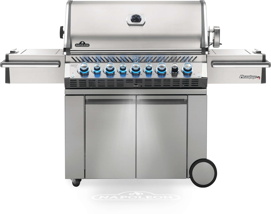 Closed front view of the Napoleon Prestige Pro 665 RSIB gas grills. Napoleon Prestige Pro RSIB BBQs feature large internal storage, collapsible side shelving, sizzle zone side sear plates, infrared UV rear burners for rottiserie or spit cooking, built-in cooler box, safety glow control knobs, and more! These are top of the line, high quality gas grills for year round use.